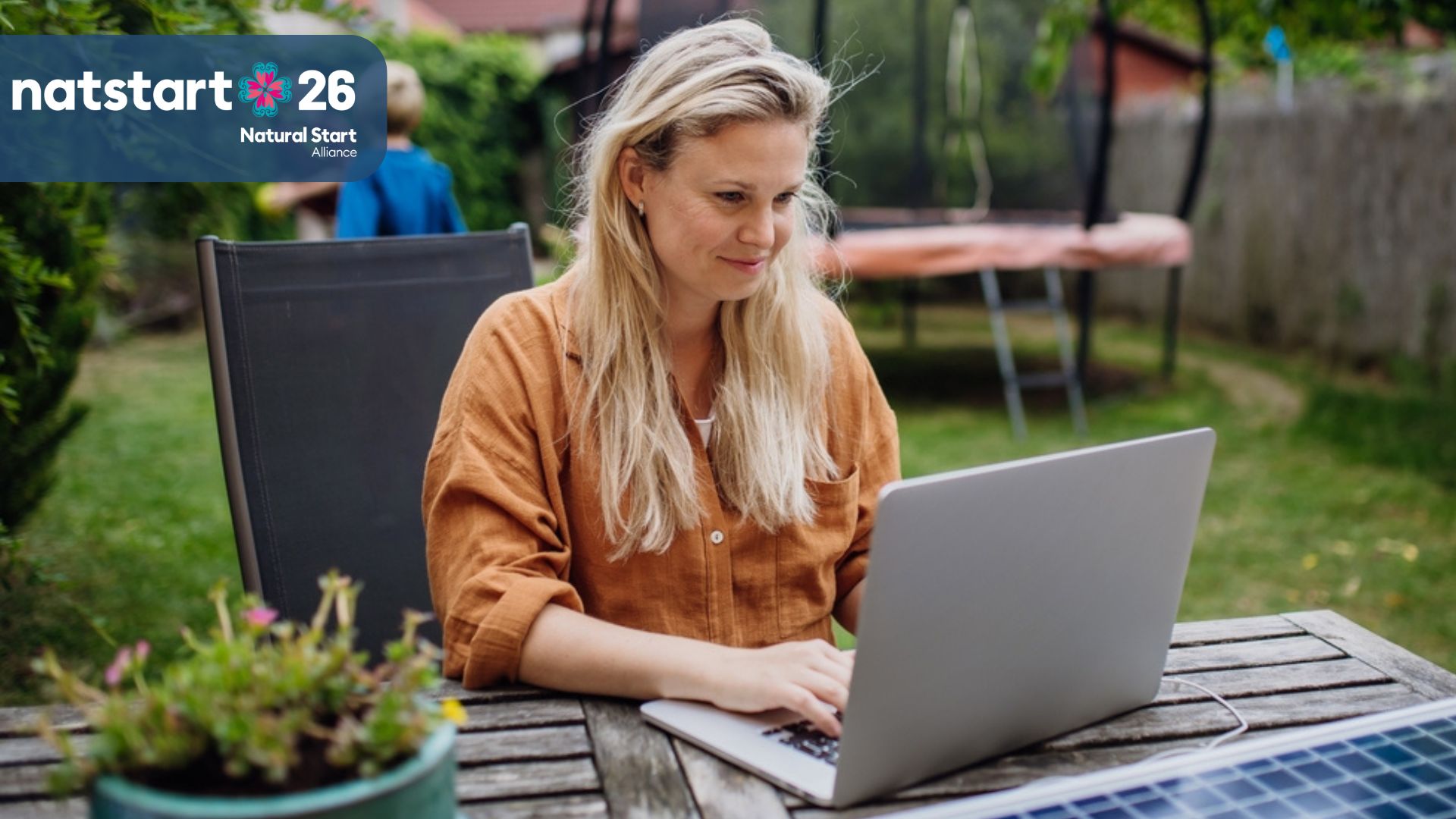 woman on laptop in backyard