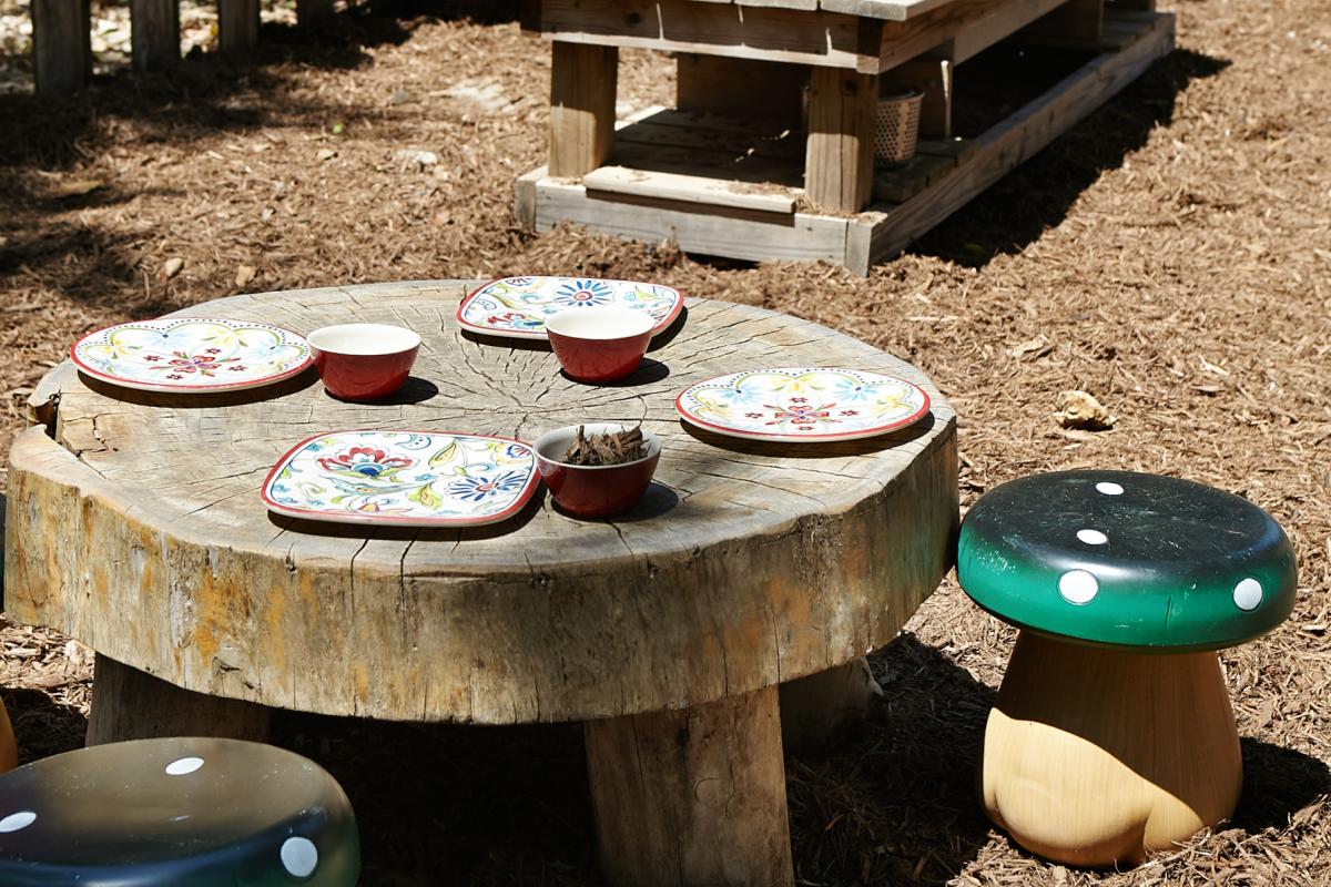 outdoor classroom space - table with mushroom space
